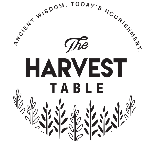 Logo for 'The Harvest Table' with text 'Ancient Wisdom. Today's Nourishment.' and leaf designs.